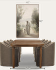 brown wooden table with gray upholstered chairs and a framed artwork above on a white background. 