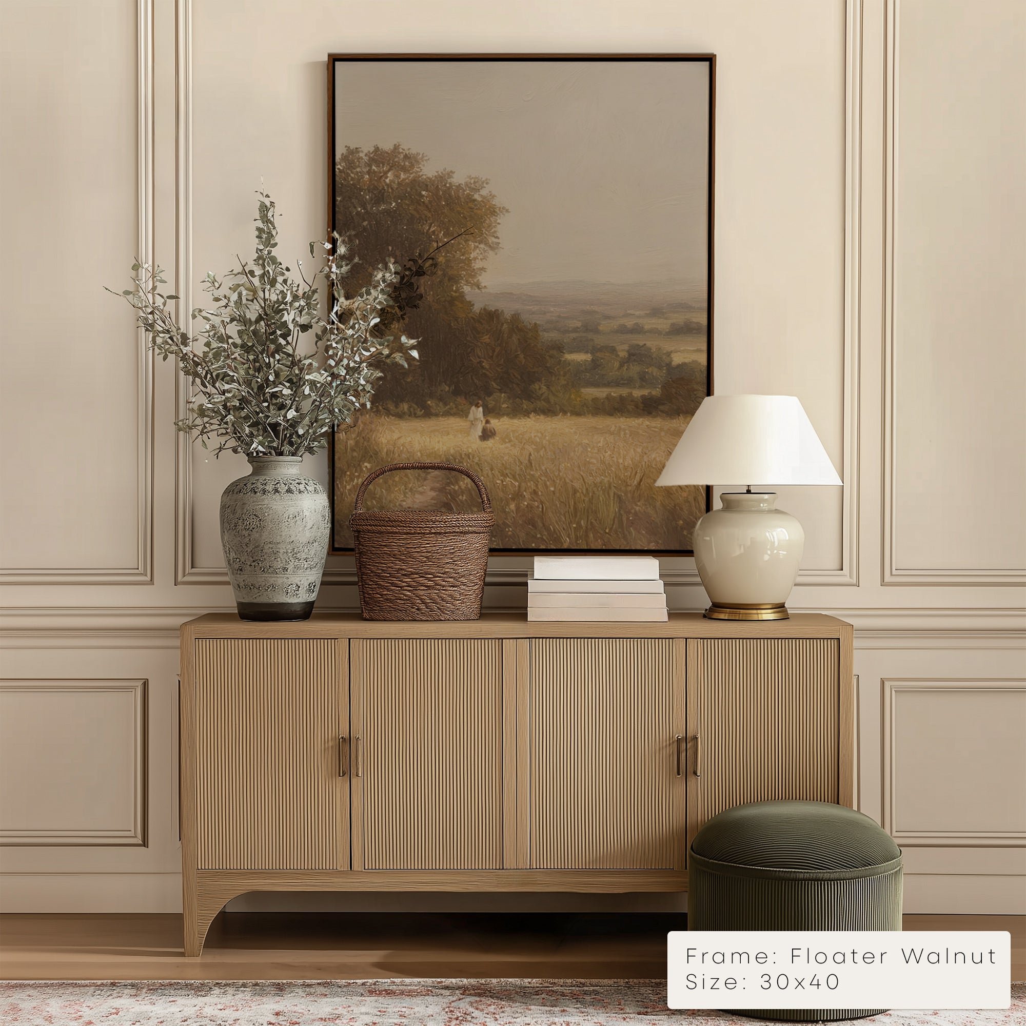 Wooden sideboard with decorative items against a wall with a framed landscape painting. __lifestyleImage