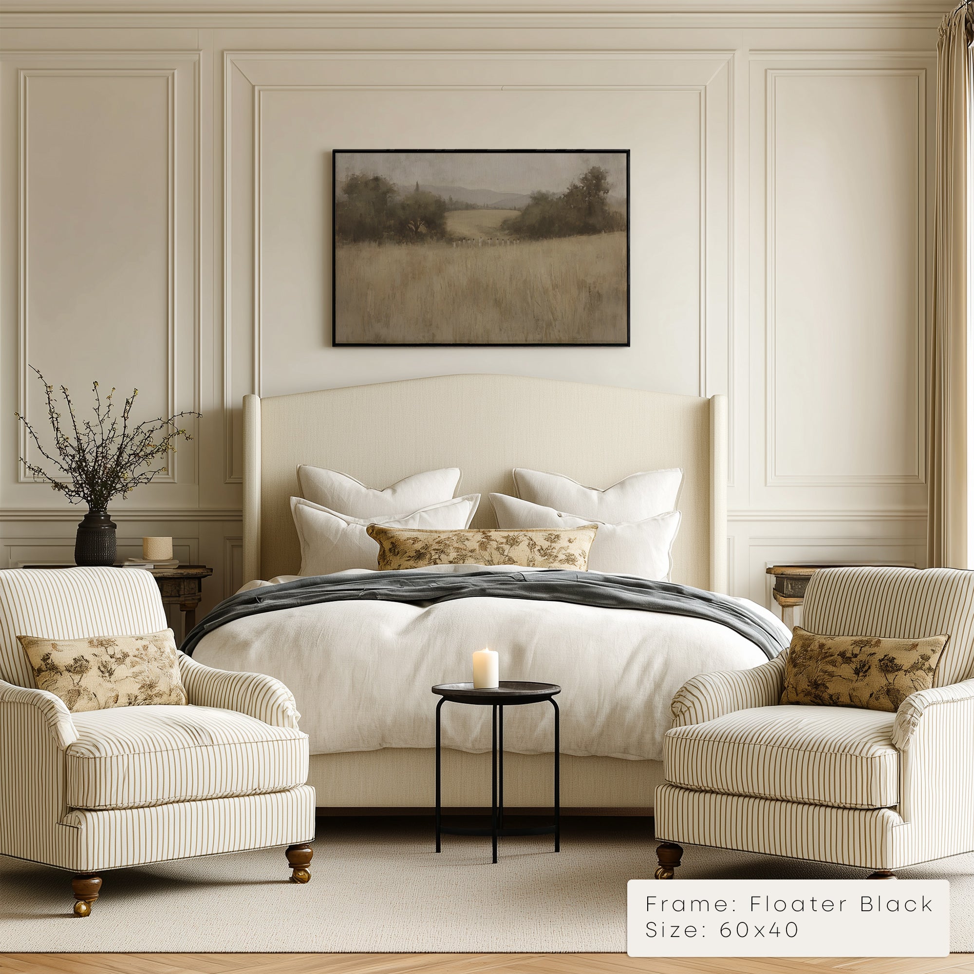 Neatly made bed with decorative pillows in a bedroom setting with armchairs and a framed picture on the wall. __lifestyleImage