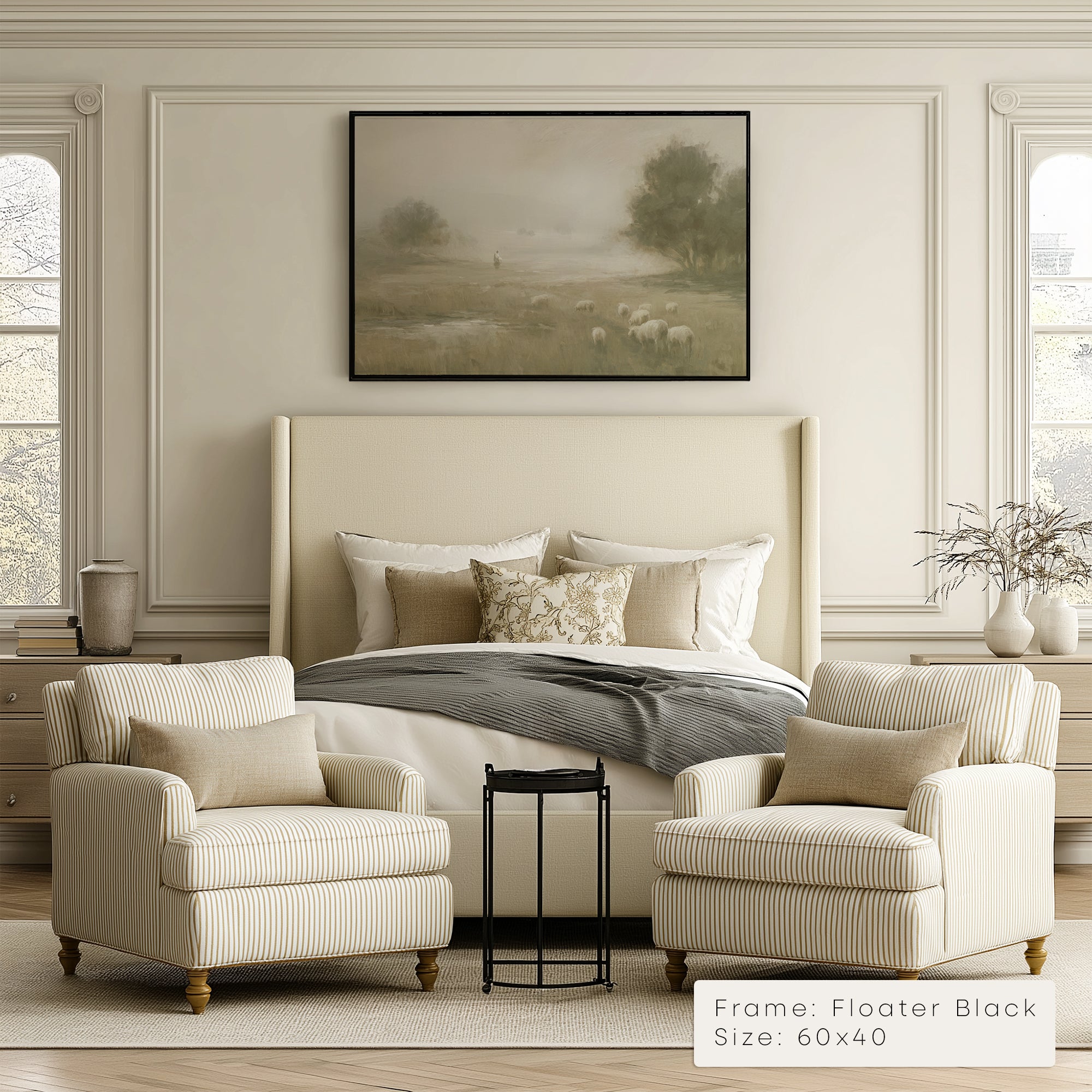 Neatly decorated bedroom with a bed, armchairs, and a framed landscape painting.