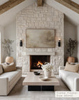 living room with stone fireplace, white sofas, and decorative elements.