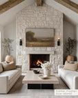 living room with stone fireplace, white sofas, and a painting above the fire. __lifestyleimage