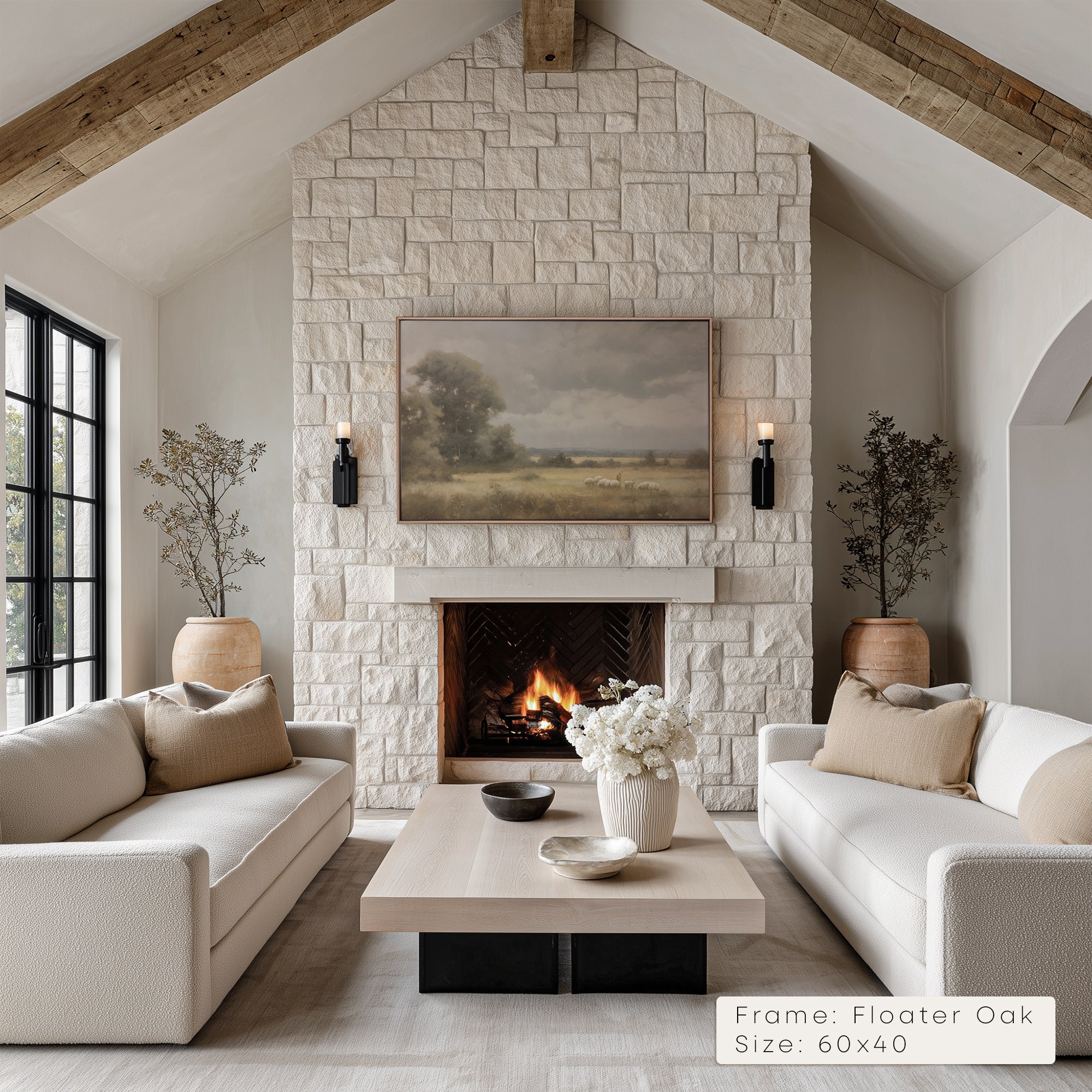 Living room with stone fireplace, white sofas, and a painting above the fireplace. __lifestyleImage