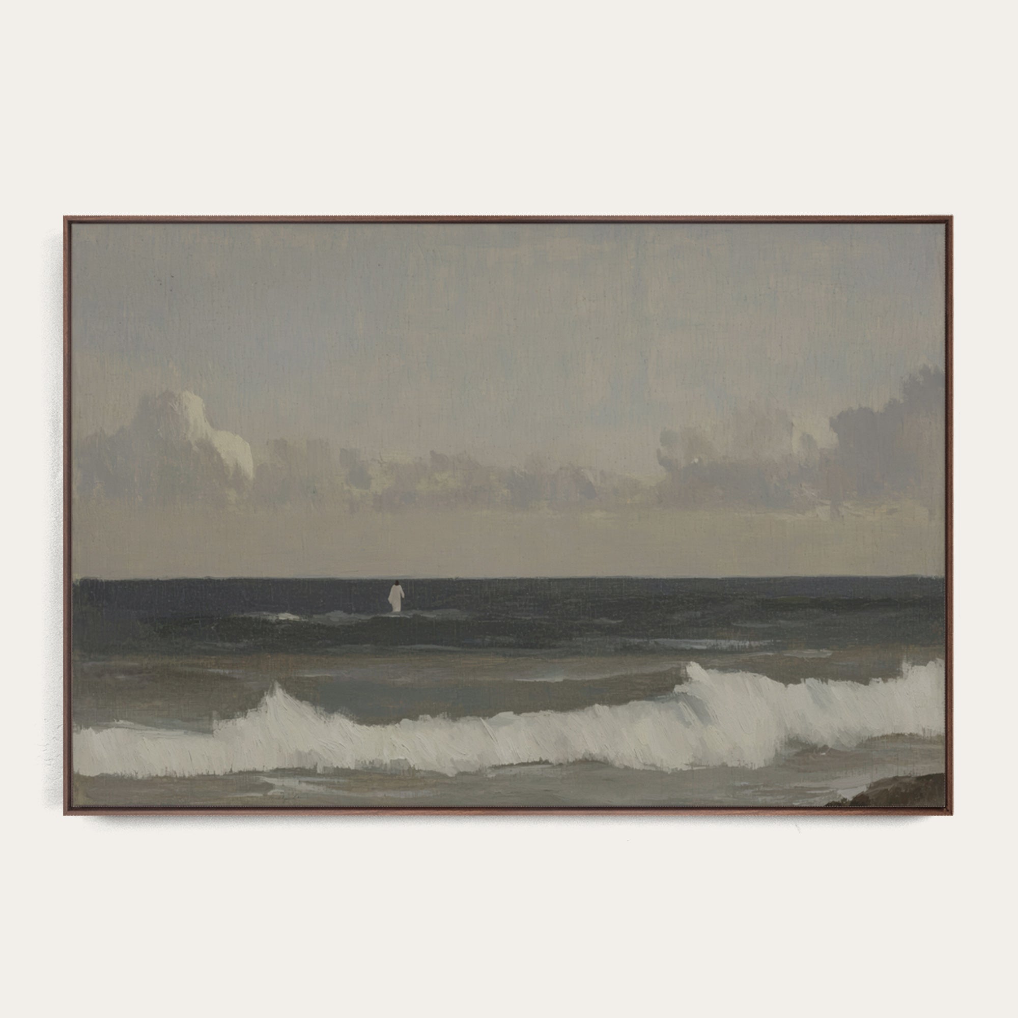 Framed artwork of a coastal scene with waves and mountains. 