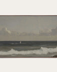 framed artwork of a coastal scene with waves and mountains. 