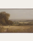 framed painting of a landscape with a person walking on a path in a field. 