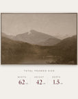 white mountains in a gold floater frame with its total framed size listed below: 62 inches wide, 42 inches high, and 1.5 inches deep. 