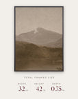 white mountains in a black floater frame with its total framed size listed below: 32 inches wide, 42 inches high, and 0.75 inches deep. 
