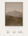 white mountains in a gold floater frame with its total framed size listed below: 32 inches wide, 42 inches high, and 0.75 inches deep. 