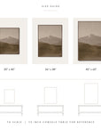 size guide showing the vertical white mountains print framed in three sizes, labeled 30" x 40", 36" x 48", and 40" x 60", drawn to scale, with each size outlined above a 79-inch console table for reference.