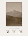 white mountains in a light oak floater frame with its total framed size listed below: 42 inches wide, 62 inches high, and 1.25 inches deep. 